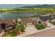 Stunning aerial view of a home with a beautiful lake and mountain backdrop at 2891 Waterfront Dr, Monument, CO 80132