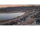 Aerial view of the home in a lakeside community with stunning mountain views at 2891 Waterfront Dr, Monument, CO 80132