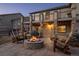 Backyard patio with outdoor fireplace and comfortable seating, perfect for entertaining at 2891 Waterfront Dr, Monument, CO 80132