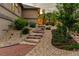 Beautiful stone stairs lead to the fenced backyard with tasteful landscaping at 2891 Waterfront Dr, Monument, CO 80132