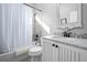 Bright bathroom featuring granite counters, framed mirror, and tiled shower with tub at 2891 Waterfront Dr, Monument, CO 80132