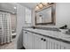 Bathroom featuring a tub and shower, granite countertops, and neutral tile at 2891 Waterfront Dr, Monument, CO 80132