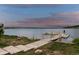 Community dock on the lake with benches and walkways for fishing and leisure at 2891 Waterfront Dr, Monument, CO 80132