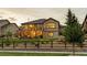 A beautifully landscaped home with a fenced yard and lovely outdoor living spaces at 2891 Waterfront Dr, Monument, CO 80132