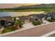 Beautiful home with mountain views, a three-car garage, and a well-maintained lawn with mature trees at 2891 Waterfront Dr, Monument, CO 80132