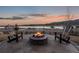 Outdoor firepit with lake and mountain views, along with comfortable ski themed seating at 2891 Waterfront Dr, Monument, CO 80132