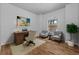 Comfortable home office with hardwood floors, contemporary furnishings and bright natural light at 2891 Waterfront Dr, Monument, CO 80132