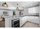 Kitchen area features a granite counter with tiled backsplash, wine cooler, and custom cabinets at 2891 Waterfront Dr, Monument, CO 80132