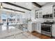 Bright kitchen featuring custom cabinets, granite counters, and stainless appliances at 2891 Waterfront Dr, Monument, CO 80132