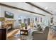 Cozy living room with a stone fireplace and beautiful hardwood floors at 2891 Waterfront Dr, Monument, CO 80132