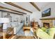 Inviting living room with a stone fireplace and natural light at 2891 Waterfront Dr, Monument, CO 80132