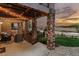 Rear covered patio features stone columns, a swing, string lights and beautiful sunset views at 2891 Waterfront Dr, Monument, CO 80132