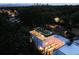 Aerial view of a modern rooftop deck featuring stylish furniture and ambient lighting for relaxing outdoor evenings at 562 Steele St, Denver, CO 80206