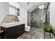 Modern bathroom with a walk-in shower featuring unique geometric tiles at 562 Steele St, Denver, CO 80206