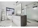 Contemporary bathroom boasting marble floors, modern fixtures, and a soaking tub at 562 Steele St, Denver, CO 80206