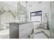 Spa-like bathroom with dual vanity, soaking tub, and luxurious glass shower at 562 Steele St, Denver, CO 80206