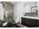 Stylish bathroom featuring modern fixtures and a walk-in tiled shower at 562 Steele St, Denver, CO 80206
