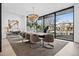 Bright dining room boasting a modern chandelier and large windows offering plenty of natural light at 562 Steele St, Denver, CO 80206