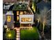 Stunning modern home with rooftop deck, manicured lawn, and beautiful outdoor lighting at 562 Steele St, Denver, CO 80206
