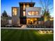 Stunning modern home featuring manicured lawn and beautiful landscaping for great curb appeal at 562 Steele St, Denver, CO 80206