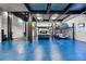 Well-lit garage with car lifts, great for car enthusiasts at 562 Steele St, Denver, CO 80206