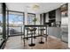 Eat in kitchen space with stainless steel appliances and adjacent balcony at 562 Steele St, Denver, CO 80206