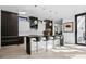 Modern kitchen featuring sleek black countertops and contemporary fixtures at 562 Steele St, Denver, CO 80206
