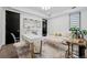 Bright and airy living room with modern furniture, including a desk at 562 Steele St, Denver, CO 80206
