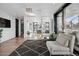 Office space with modern furniture and sliding door balcony access at 562 Steele St, Denver, CO 80206