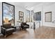 Upstairs sitting area with large windows and comfortable seating at 562 Steele St, Denver, CO 80206