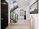 Modern staircase with glass railings and contemporary design details at 562 Steele St, Denver, CO 80206