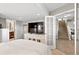 Bedroom with media center, access to bath and stairs to other level at 2550 Gold Creek Dr, Elizabeth, CO 80107