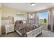 Bedroom with large window offering natural light and views of green landscape at 2550 Gold Creek Dr, Elizabeth, CO 80107