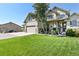 Charming home with a well-manicured lawn, complemented by a spacious three-car garage and inviting front porch at 2550 Gold Creek Dr, Elizabeth, CO 80107