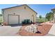 Detached garage with ample storage space, featuring multiple garage doors and side door access in a well-kept exterior at 2550 Gold Creek Dr, Elizabeth, CO 80107