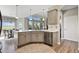 Kitchen with gray cabinets, stainless steel appliances, pendant lights, and a breakfast nook with pastoral views at 2550 Gold Creek Dr, Elizabeth, CO 80107
