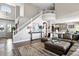 Open concept living space with a second story view, staircase and comfortable furnishings at 2550 Gold Creek Dr, Elizabeth, CO 80107