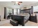 Spacious main bedroom features a dark wood furniture set and a cozy, inviting atmosphere at 2550 Gold Creek Dr, Elizabeth, CO 80107
