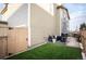 Inviting backyard featuring a patio, artificial turf, and convenient gated access at 2907 Distant Rock Ave, Castle Rock, CO 80109