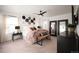 Spacious bedroom featuring a cozy bed, stylish decor, a modern ceiling fan, and plenty of natural light at 2907 Distant Rock Ave, Castle Rock, CO 80109