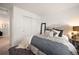 Cozy bedroom with neutral tones, comfortable bedding, and a stylish side table with decor at 2907 Distant Rock Ave, Castle Rock, CO 80109