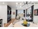 Living room showcasing hardwood floors, large windows, fireplace, and modern lighting at 2907 Distant Rock Ave, Castle Rock, CO 80109