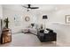 Comfortable living room with plush seating, contemporary decor, ceiling fan and plenty of natural light at 2907 Distant Rock Ave, Castle Rock, CO 80109