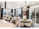 Open-concept living and dining area featuring abundant natural light, hardwood floors, and stylish contemporary furnishings at 2907 Distant Rock Ave, Castle Rock, CO 80109