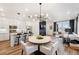 Modern open-concept living space features a bright kitchen, dining area and a comfortable living room at 2907 Distant Rock Ave, Castle Rock, CO 80109