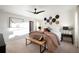 Main bedroom with a bench at the foot of the bed, ceiling fan, and large windows at 2907 Distant Rock Ave, Castle Rock, CO 80109