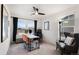Bright home office with large windows, modern desk setup, comfortable seating, and contemporary decor at 2907 Distant Rock Ave, Castle Rock, CO 80109