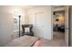 Home office with a desk, chair, and view into a living room at 2907 Distant Rock Ave, Castle Rock, CO 80109