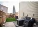 Cozy patio area with stylish outdoor seating, a fire pit, and a striped umbrella at 2907 Distant Rock Ave, Castle Rock, CO 80109