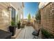 Charming patio featuring a grill, outdoor seating, and a privacy fence with green plants at 2907 Distant Rock Ave, Castle Rock, CO 80109